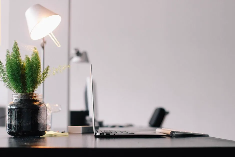 Clean minimal phone and desk setup representing a discreet, distraction-free tool